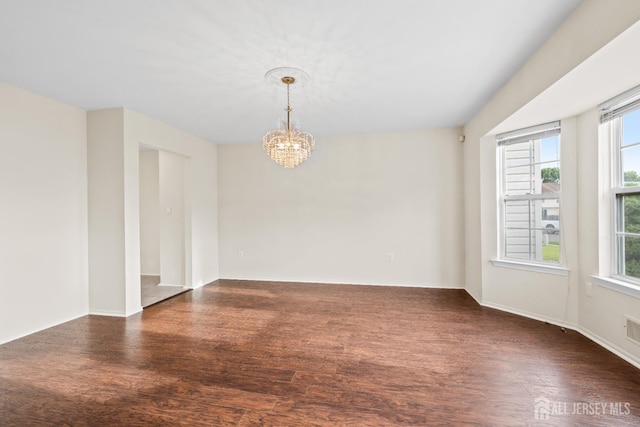 96 Lark Dr, South River, NJ 08882 - unfurnished room with a chandelier and dark wood-style floors