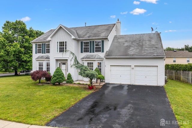 96 Lark Dr, South River, NJ 08882 - view of front of property featuring an attached garage, driveway, and a chimney