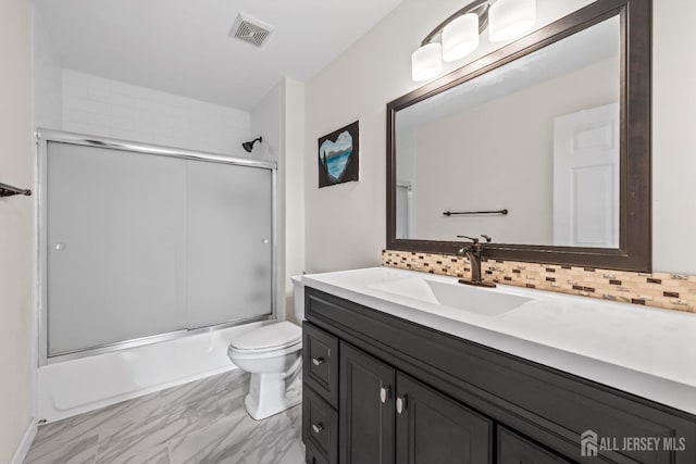 96 Lark Dr, South River, NJ 08882 - bathroom featuring vanity, backsplash, bath / shower combo with glass door, and marble finish flooring