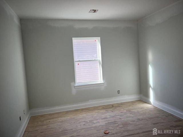 unfurnished room featuring light wood-type flooring