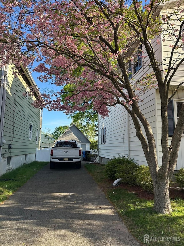 13 Lillian Ter, Woodbridge Proper, NJ 07095 - view of property exterior with driveway and a detached garage