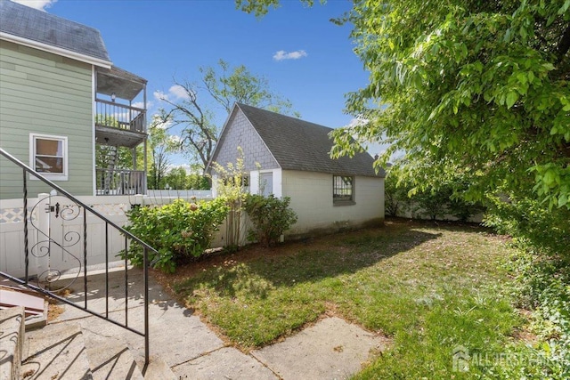 13 Lillian Ter, Woodbridge Proper, NJ 07095 - view of side of property featuring a lawn and roof with shingles