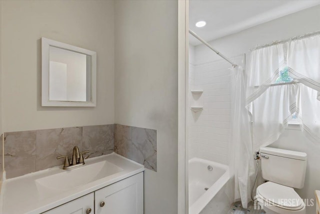 bathroom with shower / bath combo with shower curtain, toilet, and vanity