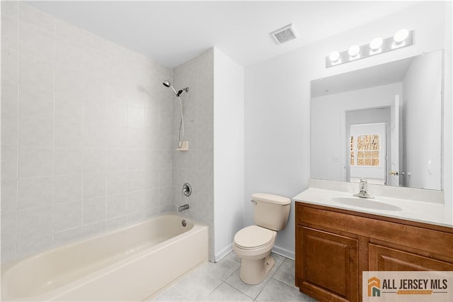 bathroom with shower / tub combination, toilet, vanity, visible vents, and tile patterned floors