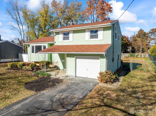 view of front facade with a garage and a front yard