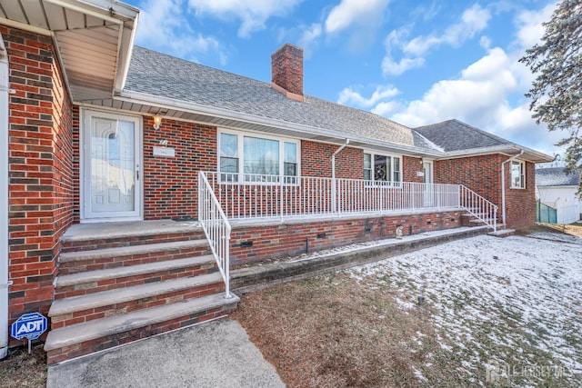 72-74 Sabo St, Carteret, NJ 07008 - property entrance featuring roof with shingles, a chimney, and brick siding