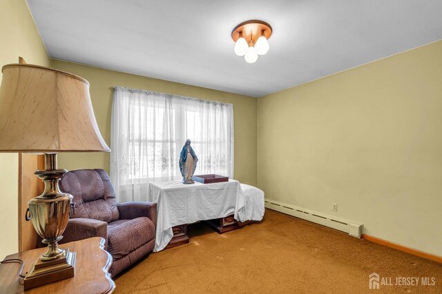 bedroom featuring carpet and baseboard heating