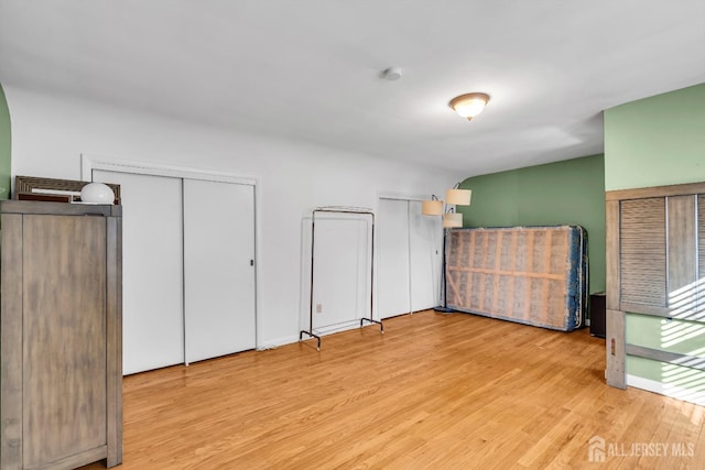 72-74 Sabo St, Carteret, NJ 07008 - unfurnished bedroom with wood finished floors and two closets