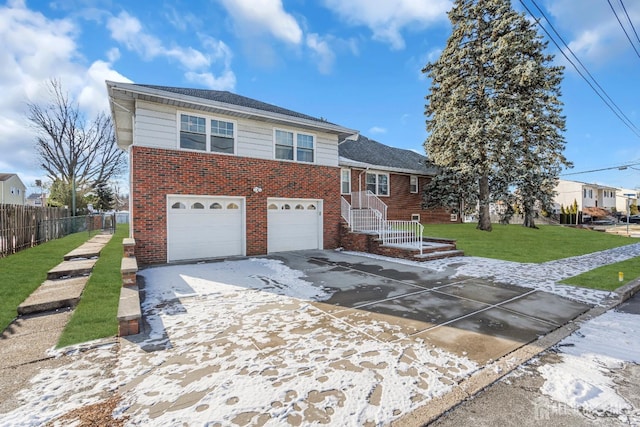 view of front of home with a front lawn and a garage