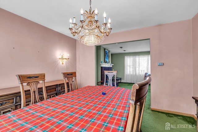 72-74 Sabo St, Carteret, NJ 07008 - carpeted dining area with a chandelier and baseboards