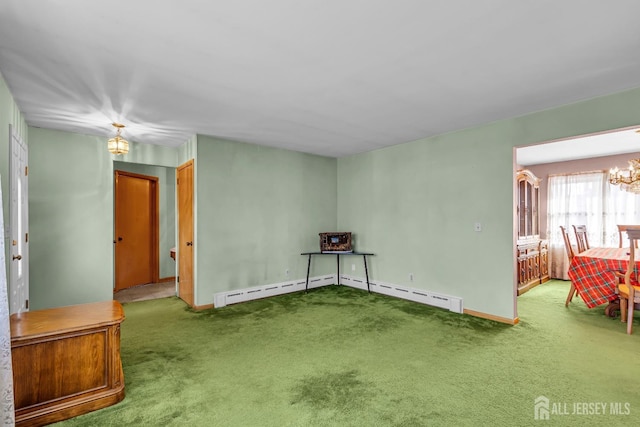 72-74 Sabo St, Carteret, NJ 07008 - carpeted spare room featuring a chandelier, baseboards, and a baseboard heating unit