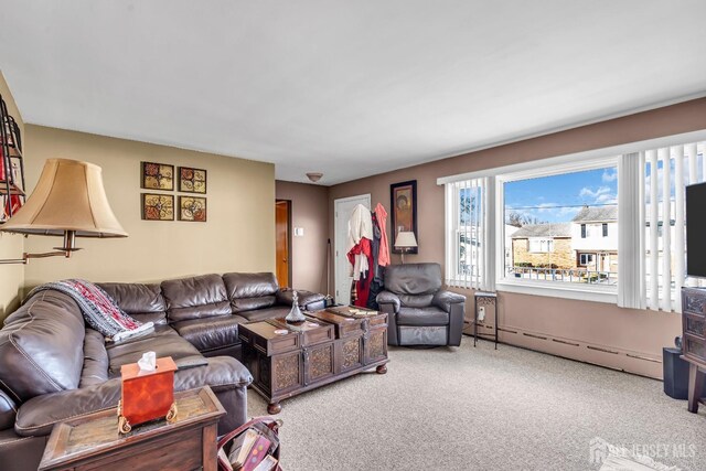 living room featuring carpet flooring and a baseboard radiator