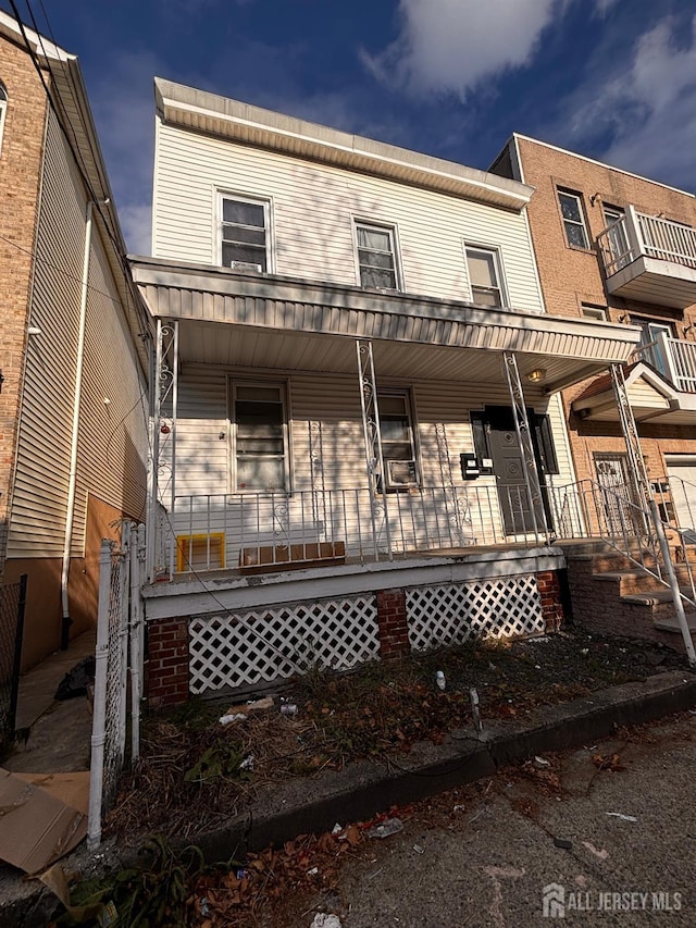 townhome / multi-family property with covered porch