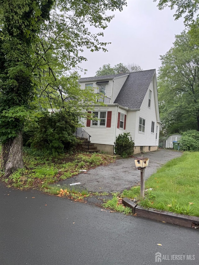 133 Harding Ave, Edison, NJ 08820 - view of front facade with roof with shingles