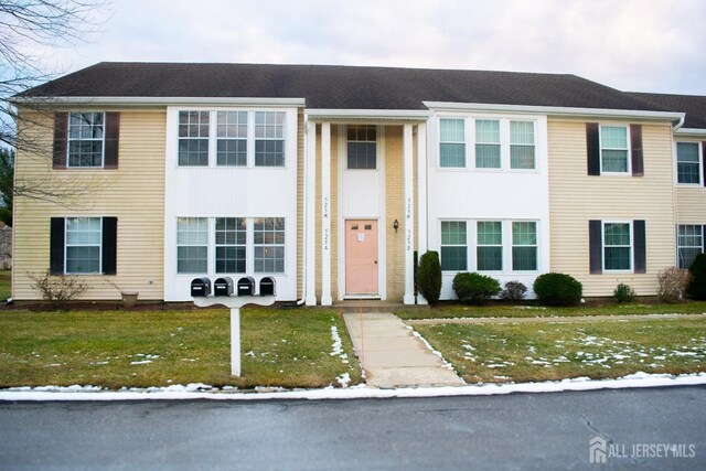 view of front of home with a front lawn