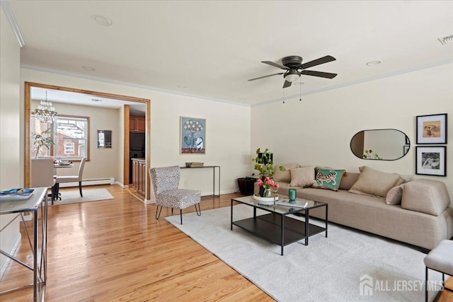 living area featuring crown molding, light wood-style flooring, ceiling fan with notable chandelier, baseboards, and a baseboard radiator