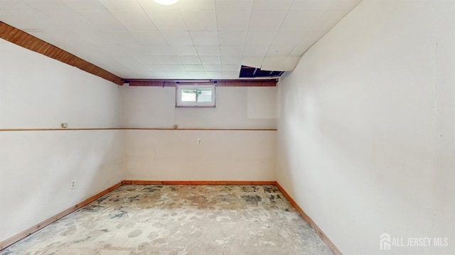 below grade area featuring baseboards