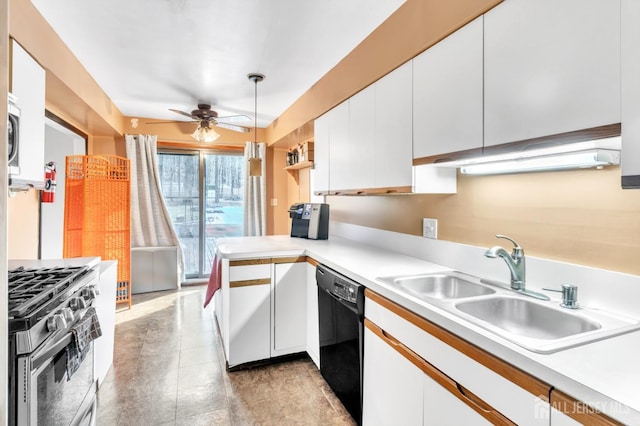 kitchen with appliances with stainless steel finishes, kitchen peninsula, pendant lighting, white cabinets, and sink