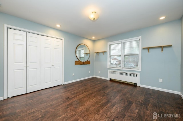 4 Ashwood Pl, North Brunswick, NJ 08902 - unfurnished bedroom featuring radiator heating unit, wood finished floors, baseboards, recessed lighting, and a closet