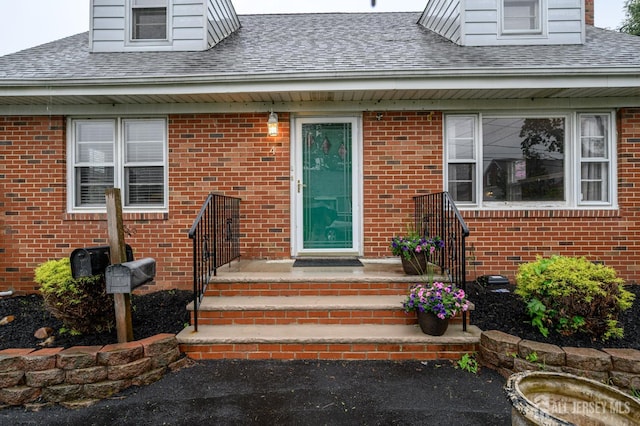 4 Ashwood Pl, North Brunswick, NJ 08902 - entrance to property featuring roof with shingles and brick siding
