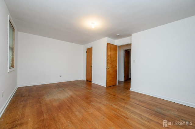 4 Ashwood Pl, North Brunswick, NJ 08902 - unfurnished room featuring light wood finished floors and baseboards