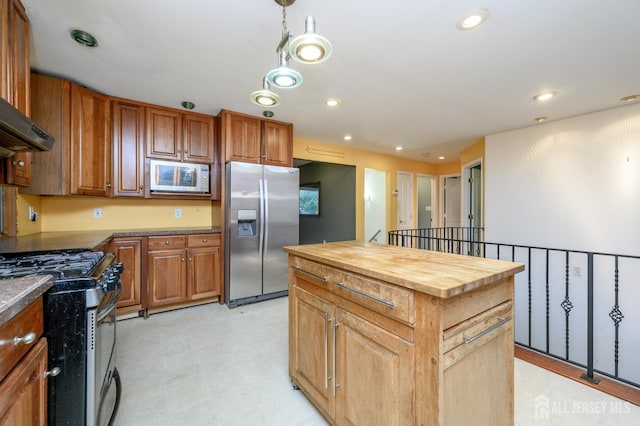 4 Ashwood Pl, North Brunswick, NJ 08902 - kitchen with stainless steel appliances, wood counters, a center island, recessed lighting, and brown cabinets