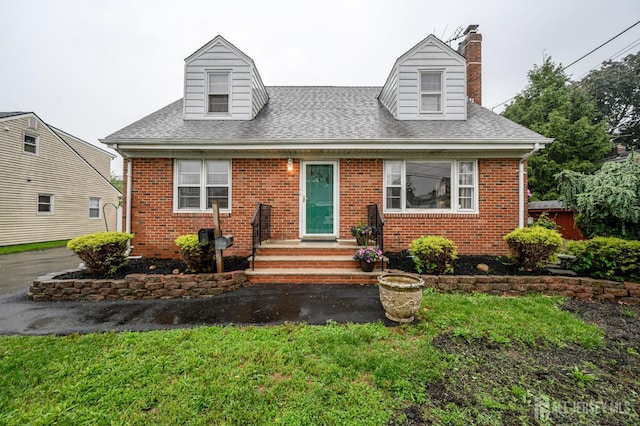 4 Ashwood Pl, North Brunswick, NJ 08902 - cape cod home with brick siding, a chimney, and a shingled roof