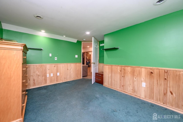 4 Ashwood Pl, North Brunswick, NJ 08902 - carpeted spare room with wainscoting, wooden walls, and recessed lighting