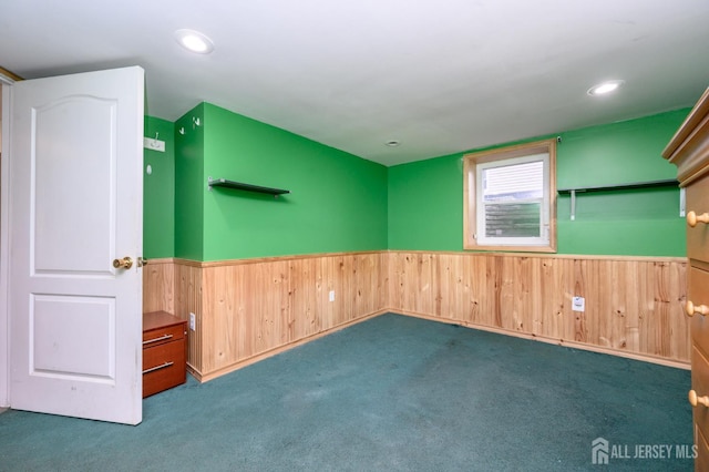 4 Ashwood Pl, North Brunswick, NJ 08902 - carpeted empty room with wainscoting, wood walls, and recessed lighting
