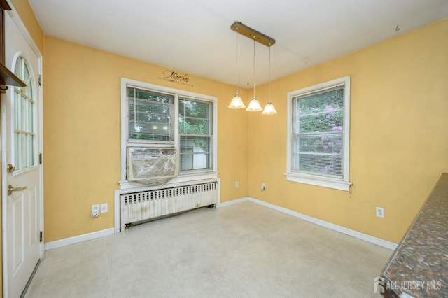 4 Ashwood Pl, North Brunswick, NJ 08902 - unfurnished room featuring radiator heating unit, healthy amount of natural light, and baseboards