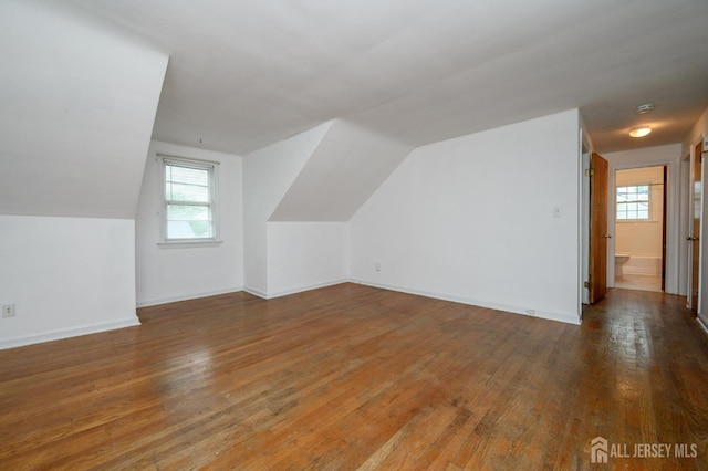 4 Ashwood Pl, North Brunswick, NJ 08902 - additional living space with wood finished floors, vaulted ceiling, and baseboards