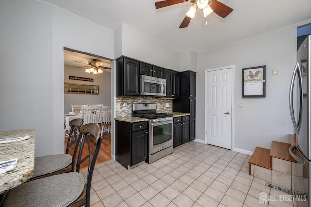 47 Lincoln Ave, Jamesburg, NJ 08831 - kitchen with tasteful backsplash, appliances with stainless steel finishes, light tile patterned floors, and a ceiling fan
