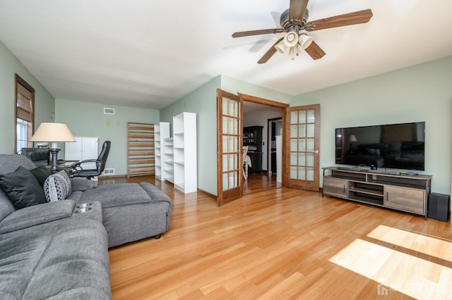 47 Lincoln Ave, Jamesburg, NJ 08831 - living room featuring visible vents, baseboards, ceiling fan, light wood-type flooring, and french doors