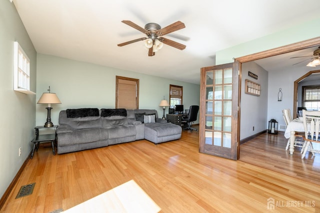 47 Lincoln Ave, Jamesburg, NJ 08831 - living room with visible vents, ceiling fan, light wood finished floors, and baseboards