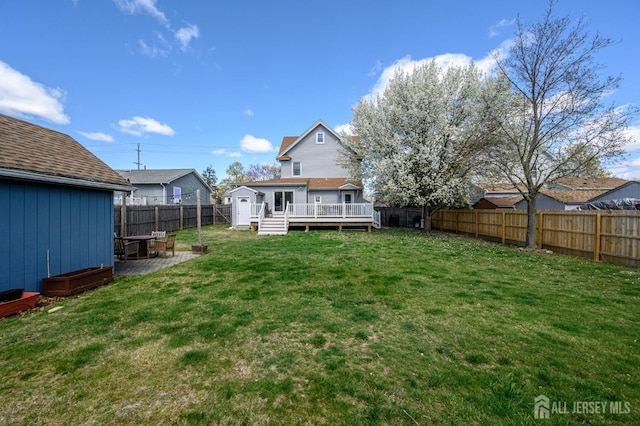 47 Lincoln Ave, Jamesburg, NJ 08831 - view of yard with a deck, a fenced backyard, and an outbuilding