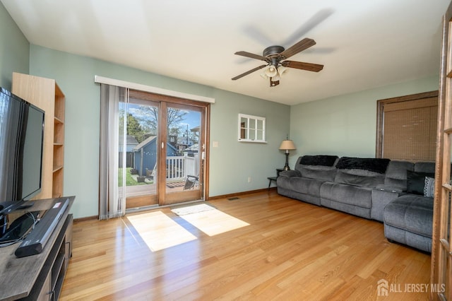 47 Lincoln Ave, Jamesburg, NJ 08831 - living area with light wood-style flooring, baseboards, and a ceiling fan