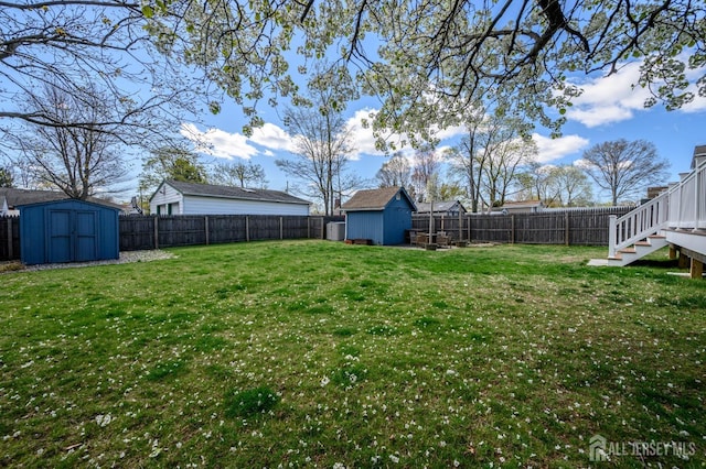 47 Lincoln Ave, Jamesburg, NJ 08831 - view of yard featuring a shed, a fenced backyard, and an outbuilding