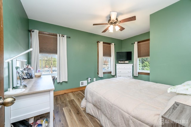 47 Lincoln Ave, Jamesburg, NJ 08831 - bedroom featuring wood finished floors, baseboards, multiple windows, and visible vents