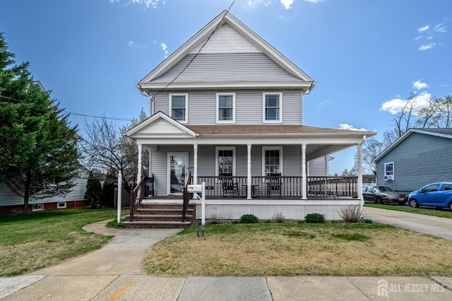 47 Lincoln Ave, Jamesburg, NJ 08831 - view of front of home with roof with shingles, a porch, and a front lawn