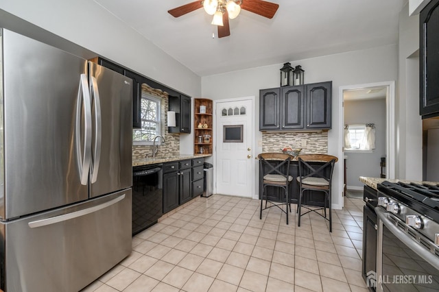 47 Lincoln Ave, Jamesburg, NJ 08831 - kitchen featuring backsplash, light stone counters, a ceiling fan, and stainless steel appliances