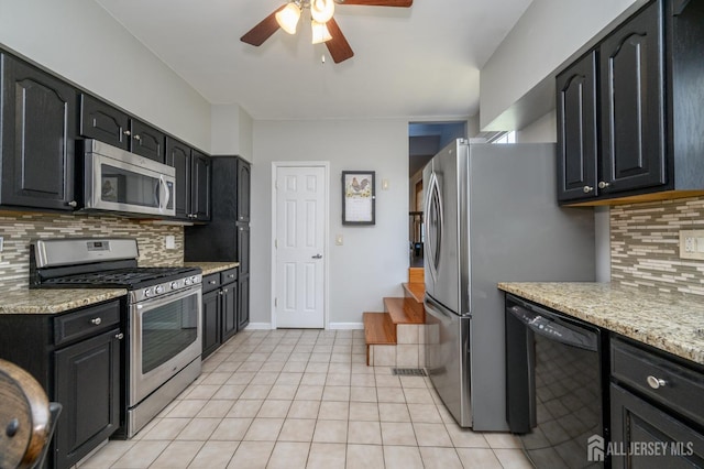 47 Lincoln Ave, Jamesburg, NJ 08831 - kitchen with tasteful backsplash, light tile patterned floors, ceiling fan, appliances with stainless steel finishes, and dark cabinets