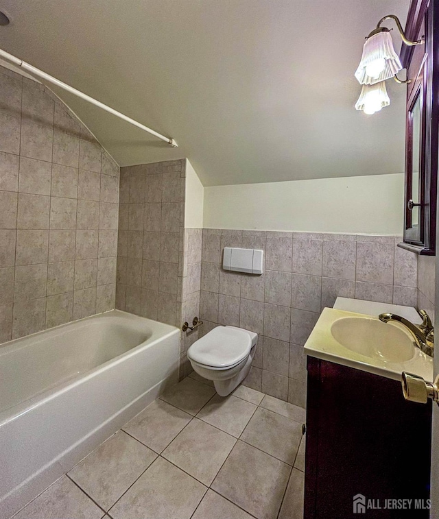 33 Timber Rd, Edison, NJ 08820 - full bath featuring tile walls, lofted ceiling, vanity, tile patterned floors, and shower / bathtub combination