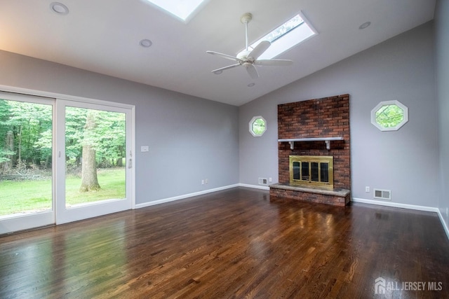 33 Timber Rd, Edison, NJ 08820 - unfurnished living room with lofted ceiling, wood finished floors, a fireplace, a skylight, and a ceiling fan