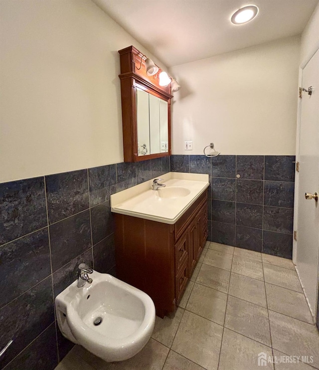 33 Timber Rd, Edison, NJ 08820 - bathroom featuring tile walls, vanity, a wainscoted wall, a bidet, and tile patterned flooring