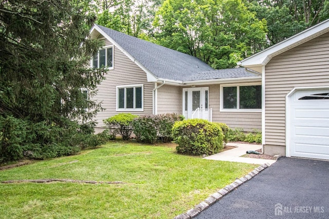 33 Timber Rd, Edison, NJ 08820 - view of front facade featuring a shingled roof, a front lawn, and a garage