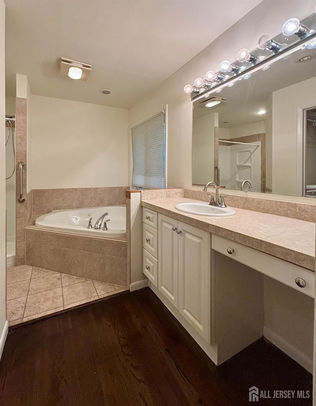 33 Timber Rd, Edison, NJ 08820 - full bath featuring a garden tub, vanity, wood finished floors, and a shower