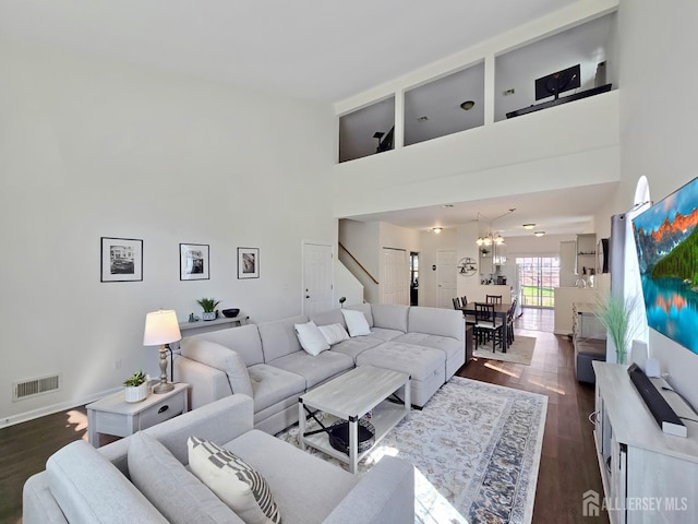 9 William Martin Way, Flemington, NJ 08822 - living room featuring a high ceiling, dark wood-type flooring, and a chandelier