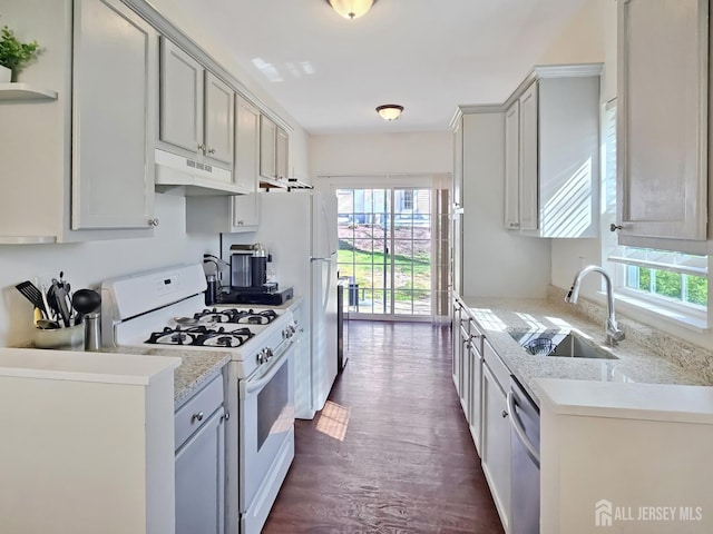 9 William Martin Way, Flemington, NJ 08822 - kitchen with white gas range oven, under cabinet range hood, healthy amount of natural light, and a sink