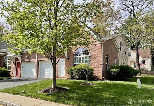 9 William Martin Way, Flemington, NJ 08822 - view of front facade with brick siding, a front yard, concrete driveway, and a garage