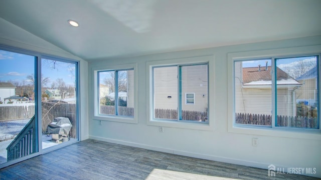 unfurnished sunroom with lofted ceiling